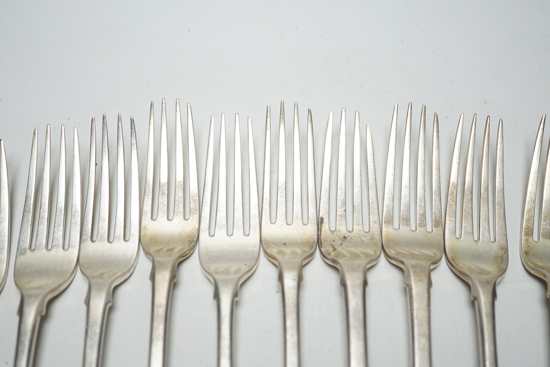 A set of twelve George III silver fiddle pattern table forks, William Eaton? London, 1812,14/15, 29.8oz.